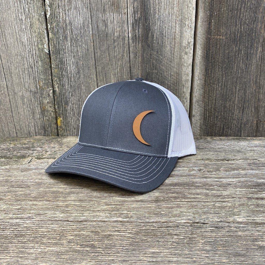 https://www.hellscanyondesigns.com/cdn/shop/products/crescent-moon-chestnut-leather-patch-hat-richardson-112-leather-patch-hats-hells-canyon-designs-charcoalwhite-656368_1200x.jpg?v=1620503962