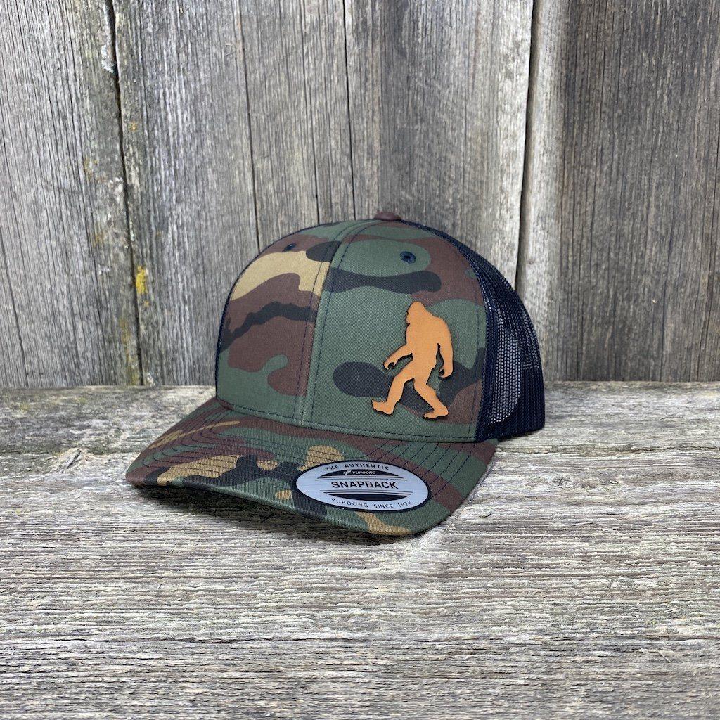 https://www.hellscanyondesigns.com/cdn/shop/products/sasquatch-leather-patch-hat-snapback-leather-patch-hats-hells-canyon-designs-tropical-multicam-409096_1200x.jpg?v=1620099960